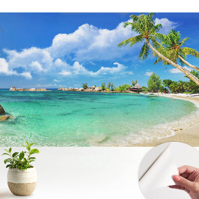 Tapeta na stenu samolepiaca s motívom exotickej plážovej zelene a paliem