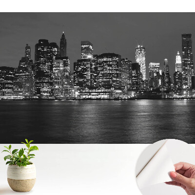 Tapeta do obývačky s panorámou mesta v noci a odrazom vo vode