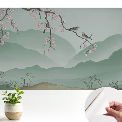 Tapeta na stenu samolepiaca s motívom kvetov a vtákov na pozadí kopcov