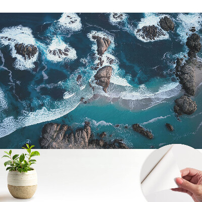 Tapeta do obývačky Pohľad na oceán so skalami zhora v živých farbách