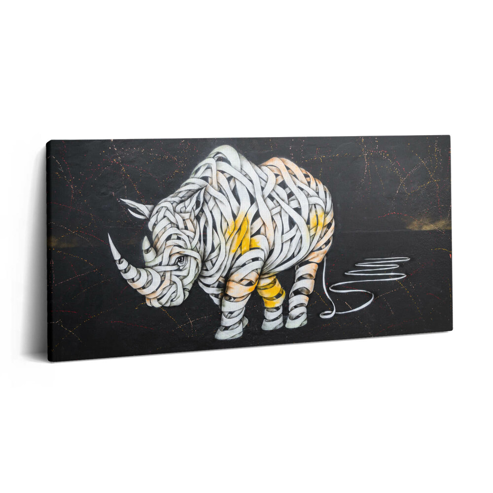 Obraz na plátne 100x50 Nosorožec z pások na čiernom pozadí.