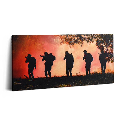 Obraz na plátne 100x50 Siluety vojakov pri západe slnka.