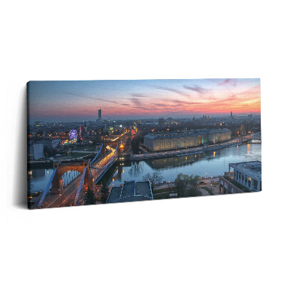 Fotoobraz na plátne 120x60 Mesto pri rieke za súmraku