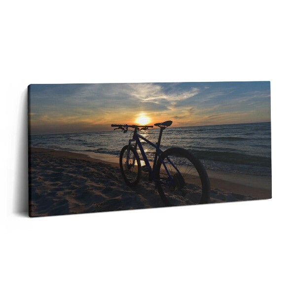 Obraz na plátne 120x60 Bicykel pri západe slnka na pláži
