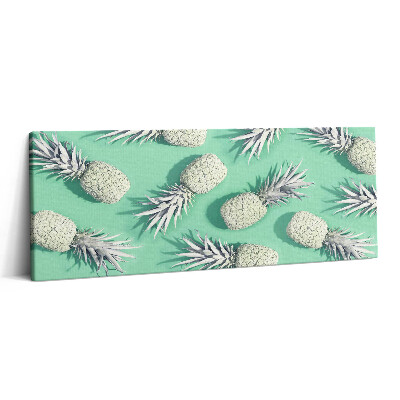 Obraz na plátne 125x50 Biele ananásy na mätovom pozadí