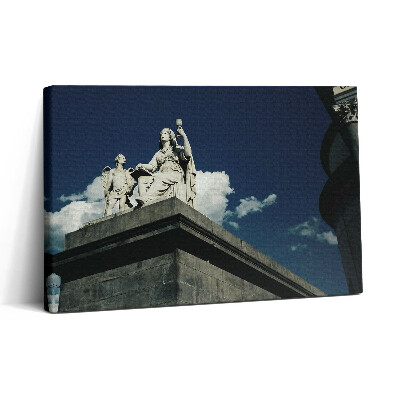 Obraz na plátne 30x20 Socha na streche s oblakmi