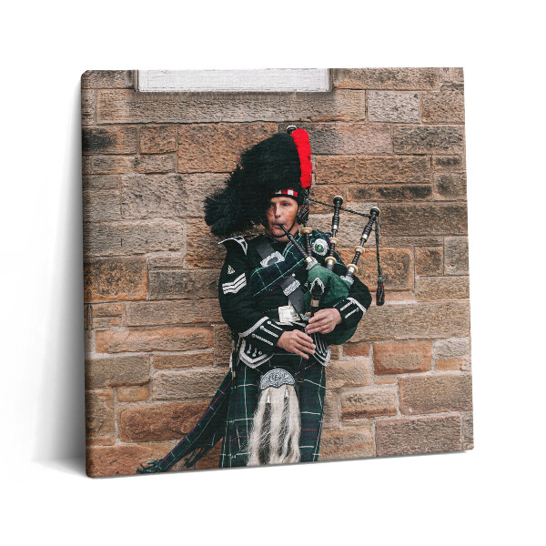 Fotoobraz na plátne 60x60 Muž s dudami pri kamennej stene