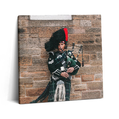 Fotoobraz na plátne 60x60 Muž s dudami pri kamennej stene