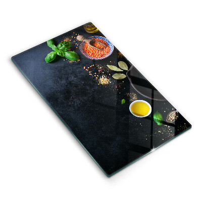 Kryt na sklokeramickú varnú dosku Kulinárske korenie na tmavom pozadí