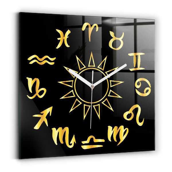 Štvorcové sklenené hodiny Zlaté astrologické znamenia na čiernom pozadí.